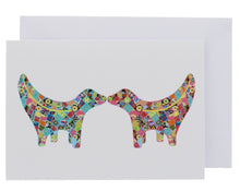 Load image into Gallery viewer, Greeting card showing two Super Lambanana statues kissing each other, in Tula Moon's distinctive colourful patchwork style.