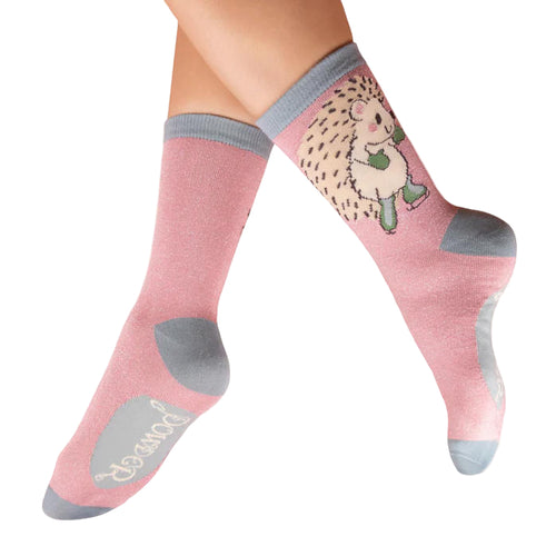 Pink socks with a cartoon hedgehog in ice skates design on a white background