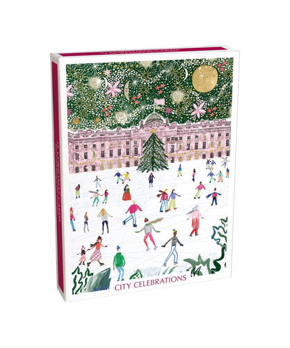 A box of Christmas cards with festive illustration of a city scene, Christmas tree, and people skating.