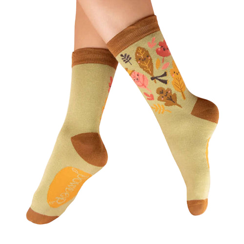Pair of socks with autumn-themed design on a white background