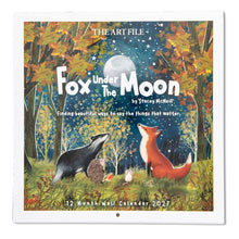 Load image into Gallery viewer, A square wall calendar titled "Fox Under the Moon" by Stacey McNutt, shown hanging against a white wall. The cover art features a forest scene with autumn trees, a fox, a badger, hedgehogs, and a full moon under a starry night sky.