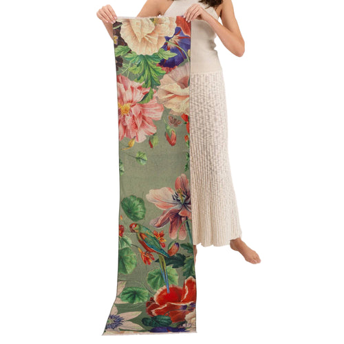 Person holding a floral-patterned, sage green scarf.