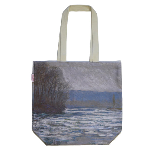 Tote bag with a scenic design of a lake and trees on a plain background