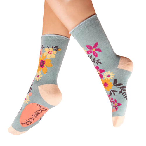 Blue socks with floral patterns on a white background