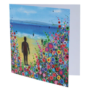 Greeting card with a painting of the statues on Crosby beach in the sunshine with a floral design.