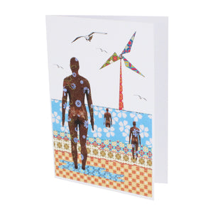 Greeting card showing a stylised illustration of Crosby beach in Tula Moon's distinctive bright patchwork style.
