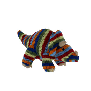 Knitted, stripey, multi-coloured soft triceratops toy.