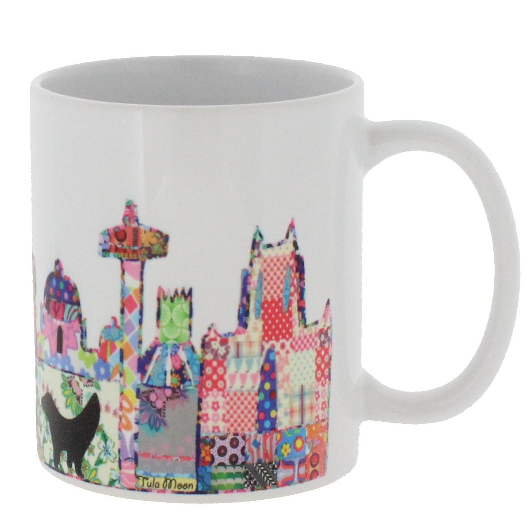 Ceramic mug featuring Liverpool's skyline in Tula Moon's distinctive bright patchwork style.