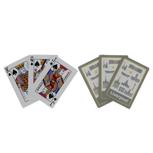 Two sets of three cards, each fanned out, one set showing the front of the cards and one set showing the back.