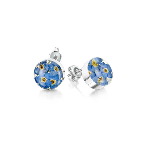 Pair of stud earrings with a circle of resin encasing forget me not flowers on silver backs